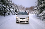 Car driving on a snowy road